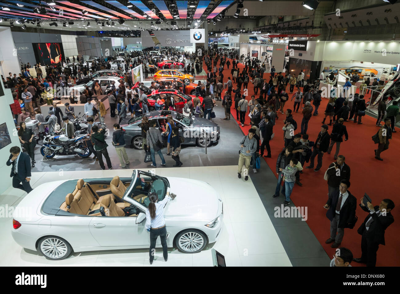Interior view of exhibition hall at Tokyo Motor Show 2013 with large crowds of visitors Stock Photo