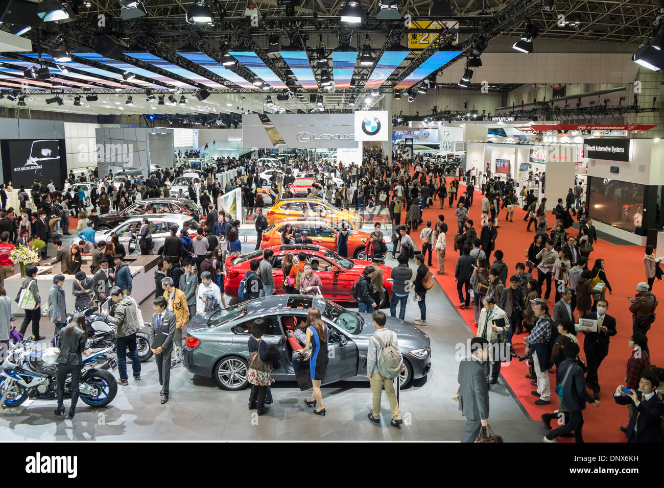 Interior view of exhibition hall at Tokyo Motor Show 2013 with large crowds of visitors Stock Photo