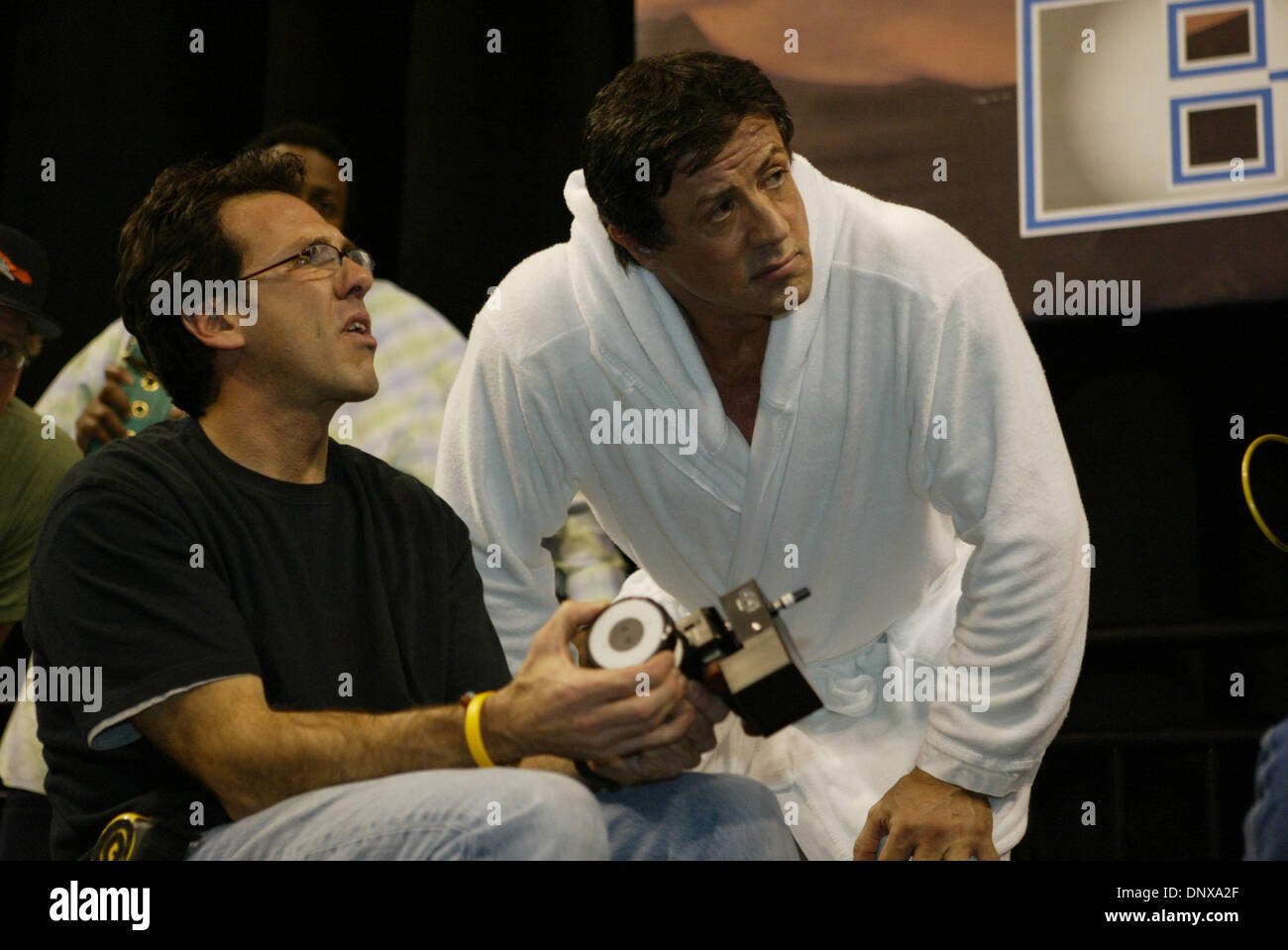 Dec 02, 2005; Las Vegas, NV, USA; Actor/director SYLVESTER STALLONE who is directing and starring in his new movie 'Rocky 6' discussing the 'Rocky 6' film set with a cameraman. Tarver portrays Stallone's opponent Mason Dixon. Stallone and Tarver had a mock weigh-in for the movie at the Mandalay Bay Hotel & Casino. Mandatory Credit: Photo by Mary Ann Owen/ZUMA Press. (©) Copyright 2 Stock Photo