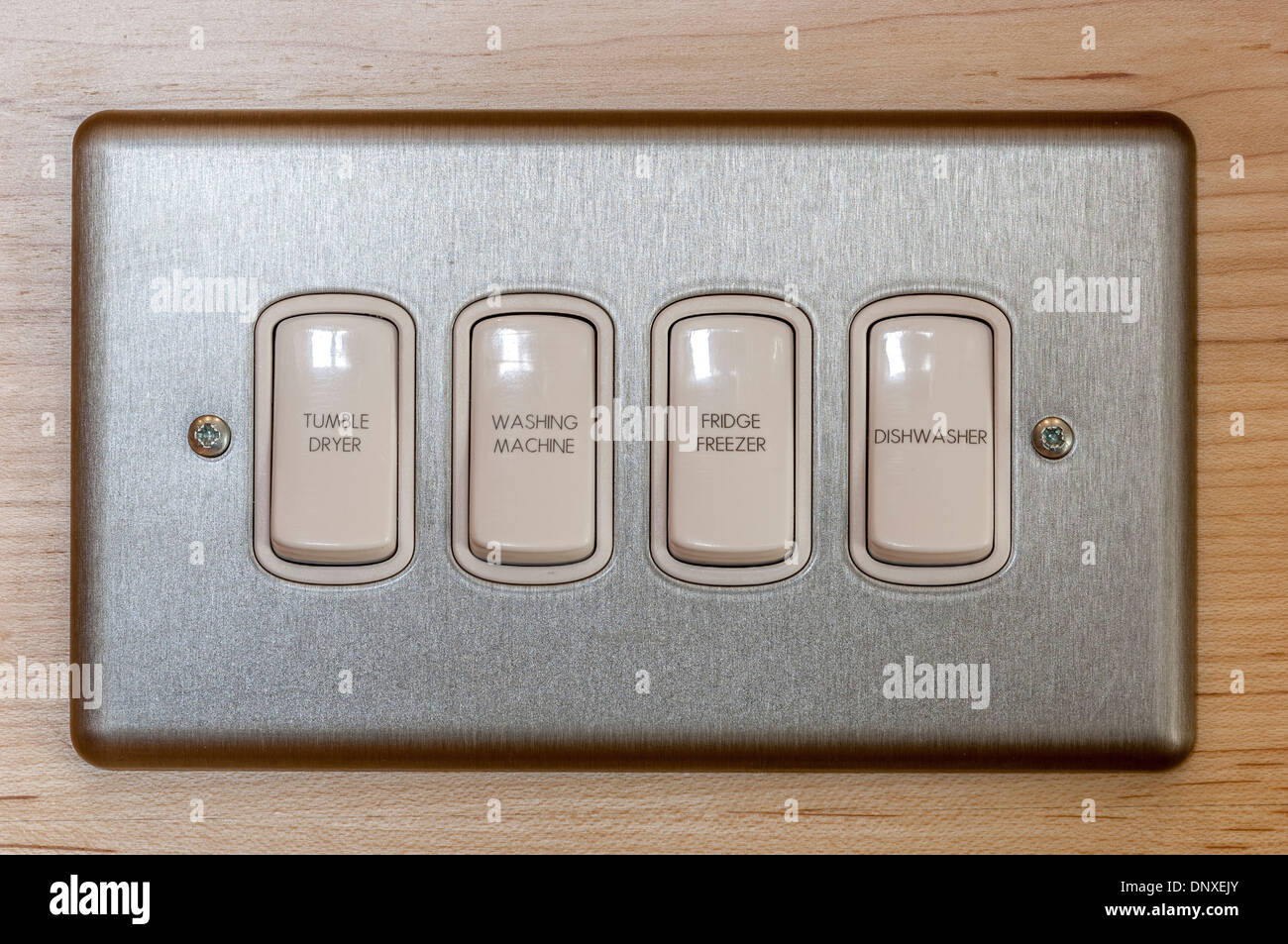 Multiple switches for domestic appliances on a single switchplate Stock
