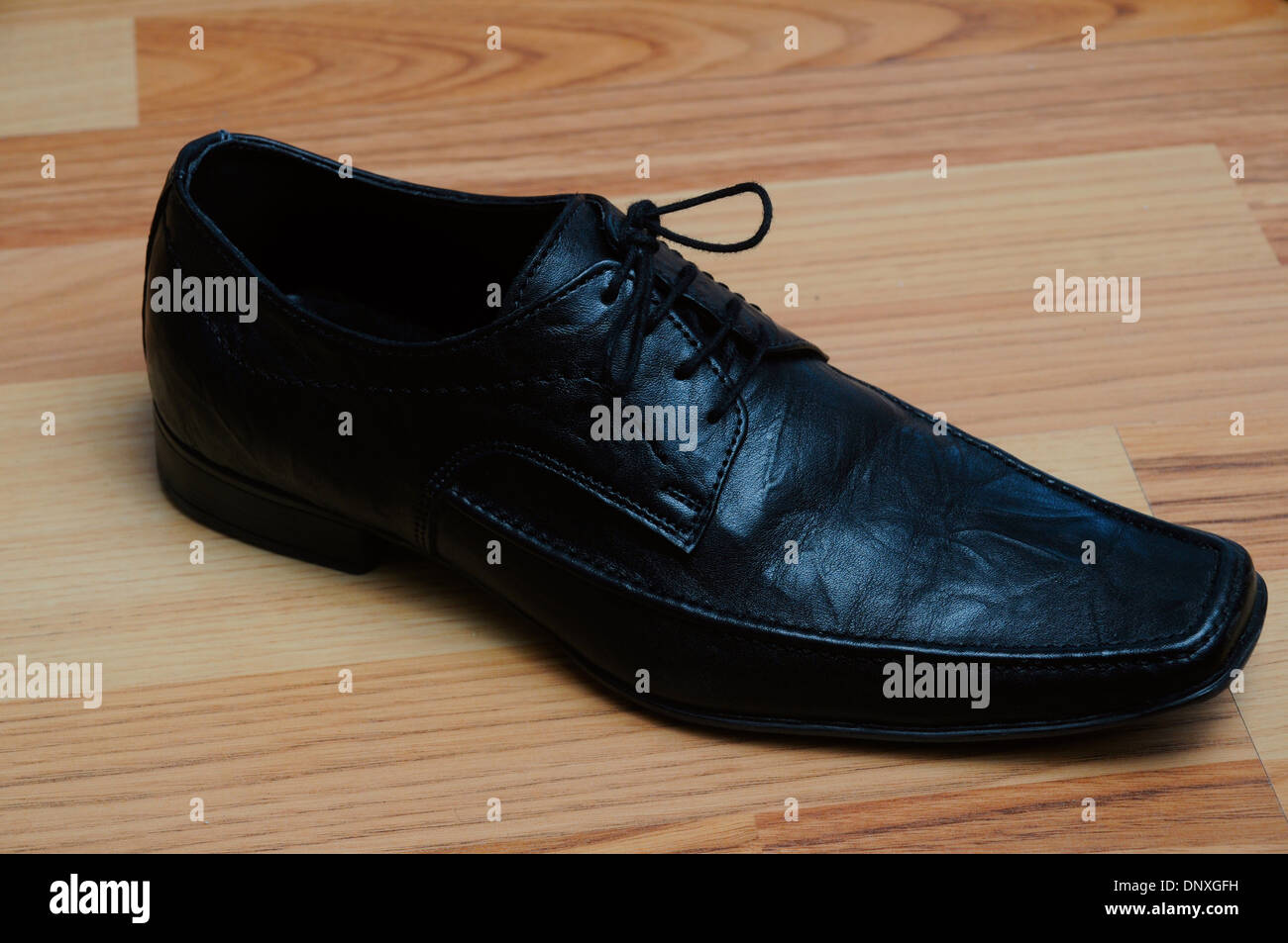 Black leather dress shoe. Stock Photo