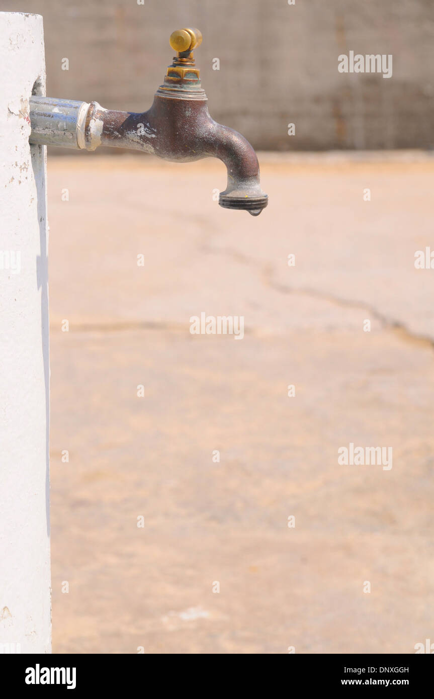 Faucet drips with copy space. Stock Photo