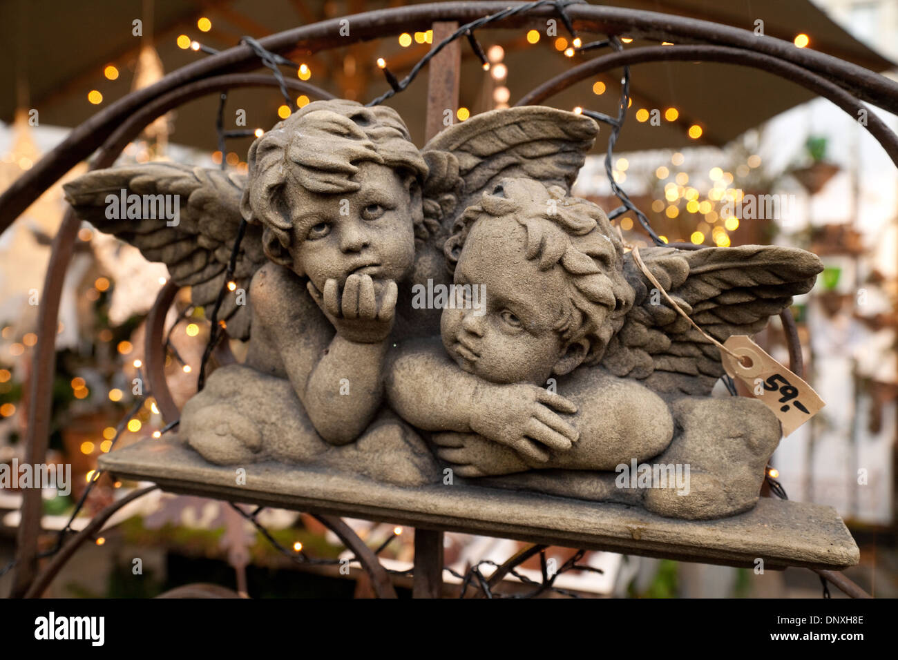 A pair of stone cherubs for sale, Stock Photo