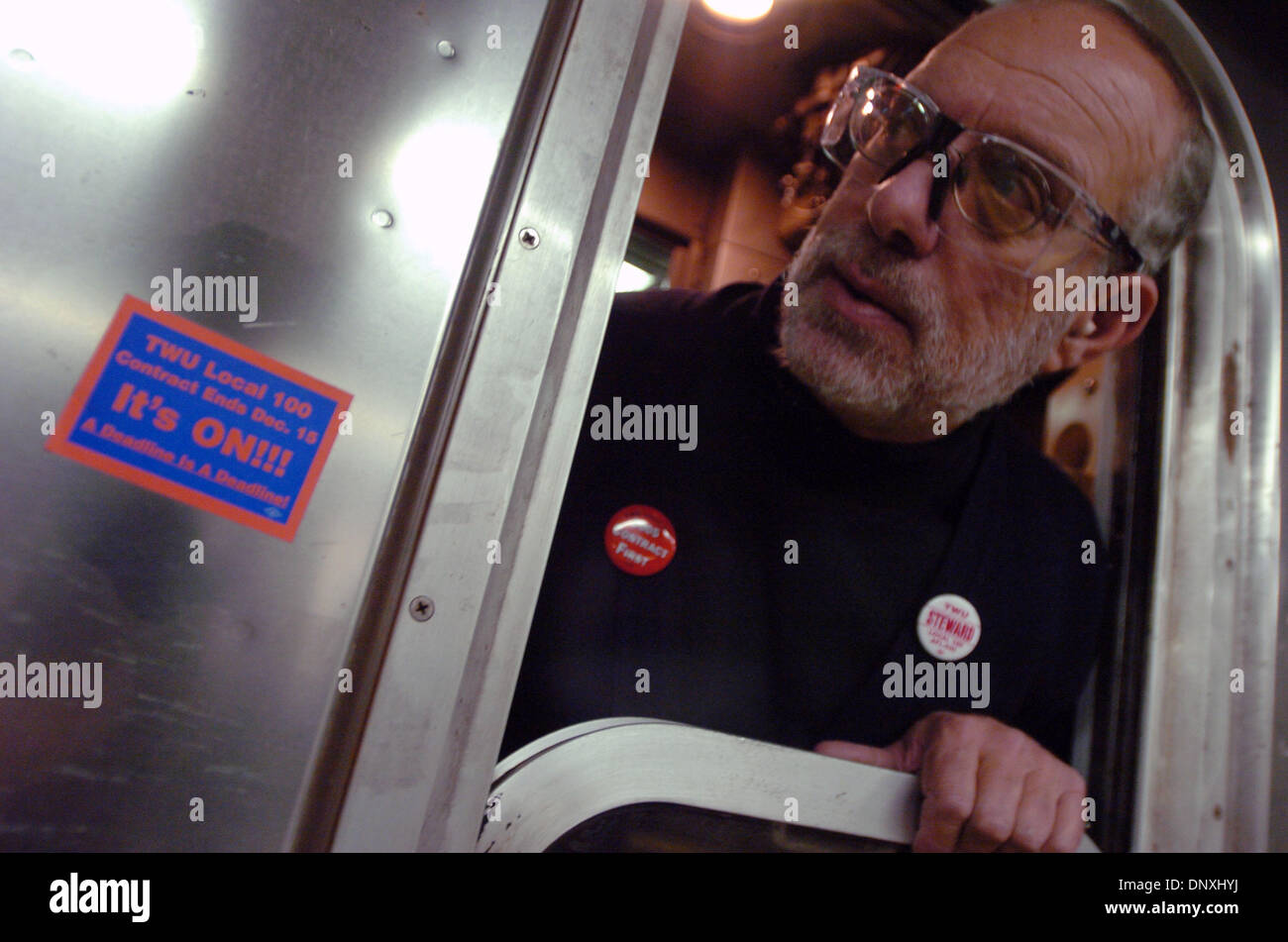 Dec 15, 2005; New York, NY, USA; A subway conductor rides a train with a strike sticker on the car near his window while the Transport Workers Union Local 100 has threatened to walk out on strike if their contract demands are not met by 12:01 am Friday, Dec. 16. A strike by TWU workers would throw NYC's transportation into chaos affecting commuters and business owners alike. Pictur Stock Photo