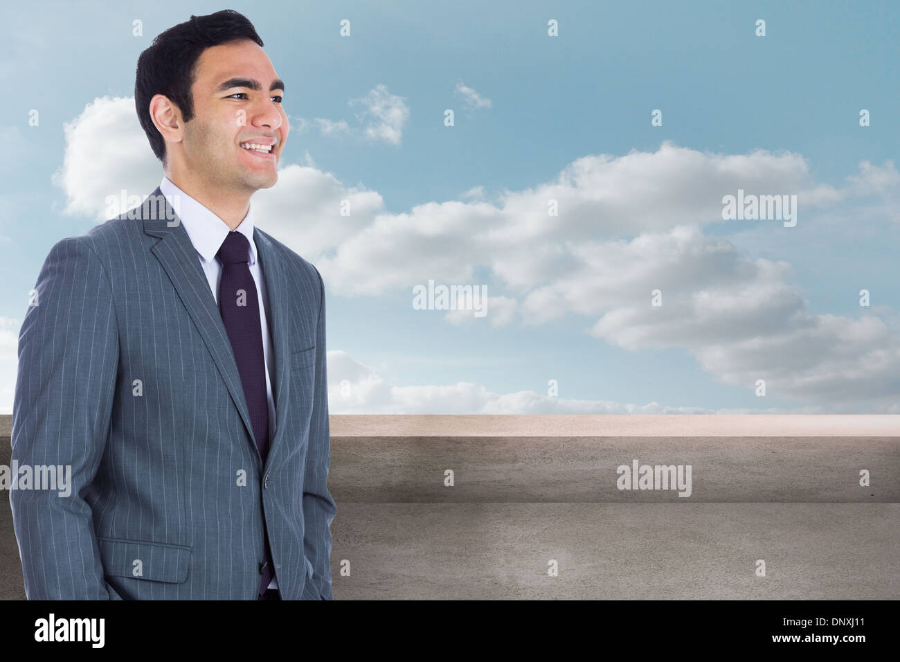 Composite image of smiling businessman standing Stock Photo - Alamy