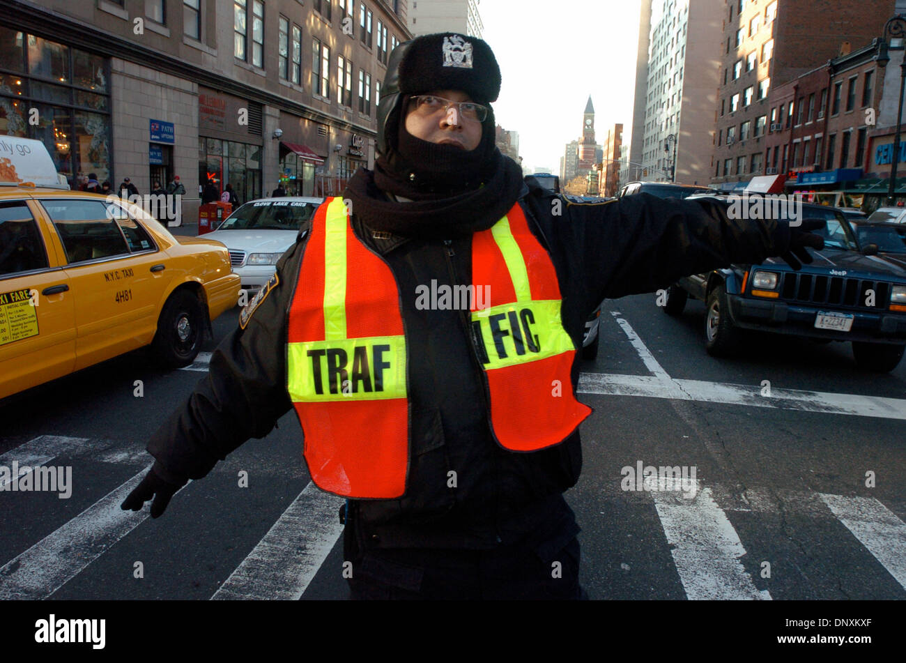 Dec 21, 2005; Manhattan, New York, USA; Traffic Agent Hossain of the T401 in Queens directs traffic a the intersection of 14th Street and 6th Avenue on the second day of the strike. Unable to reach an agreement with the Metropolitan Transportation Authority, NYC's 33,000 transit workers represented by Transport Workers Union Local 100 President Roger Toussaint walked off the job at Stock Photo