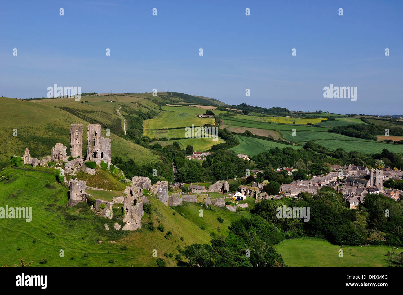 A view of the ruins of Corfe Castle in the Purbeck Hills Dorset UK Stock Photo