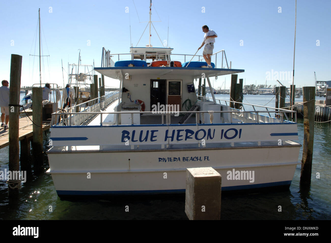 Jan 05, 2006; Riviera Beach, FL, USA; Capt. JACK DONOVAN readies a deep-water fishing boat for customers at Riviera Beach, FL. The family-owned business may be forced out if the town proceeds with redevelopment, as the town's mayor wants to eliminate the area's high unemployment and seedy appearance by redeveloping waterfront under much debated state eminent domain law. Mandatory C Stock Photo