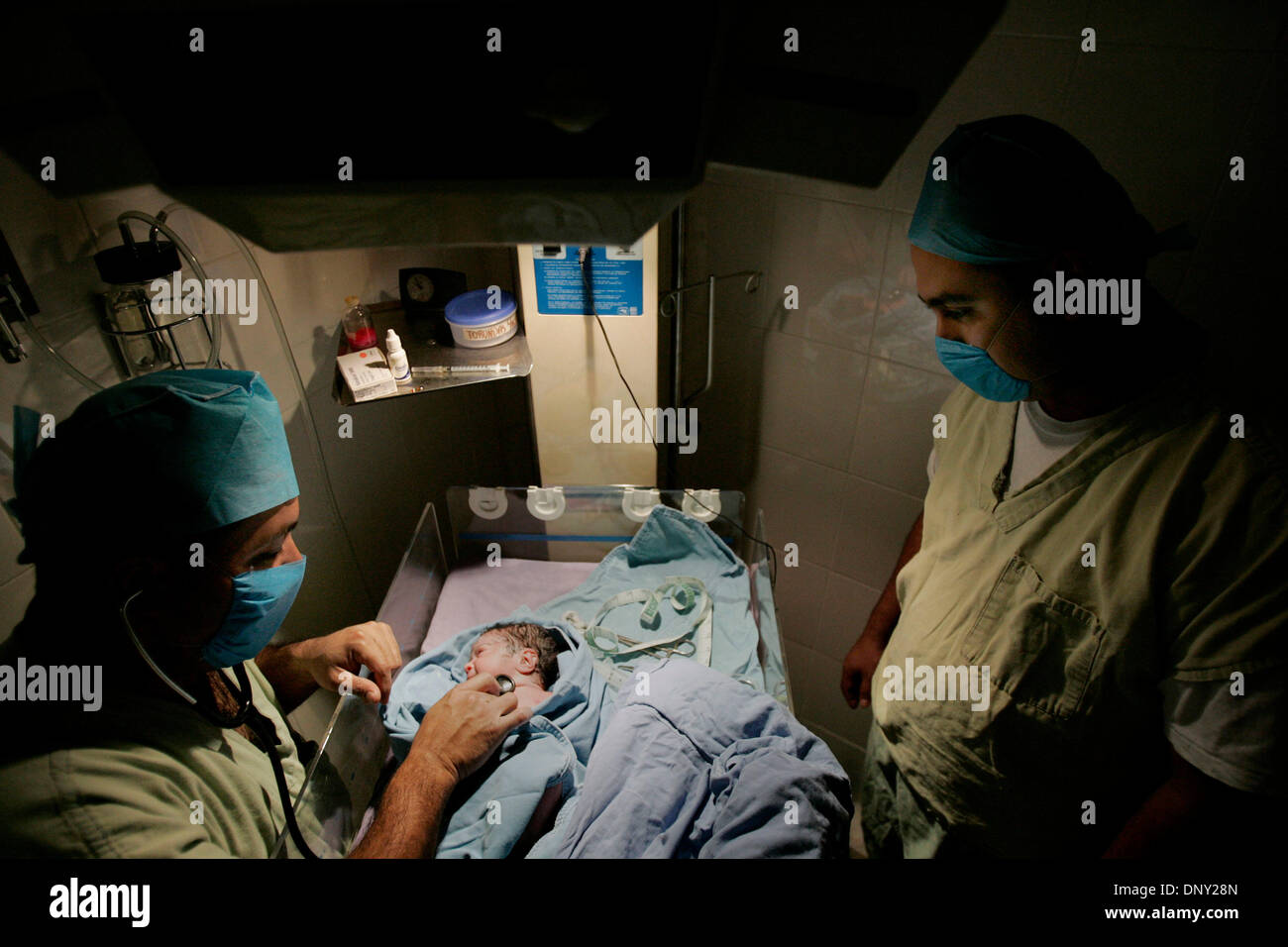 Jan 12, 2006; Axochiapan, MEXICO; Luz Elena Sanchez Pacheco weighed in at 3.4 kilograms in Axochiapan's Clinica San Antonio, January 12, 2006.  Her father, Raul Pliego Sanchez, right, now an accountant at the clinic, was able to finance his education with money he earned working at the Mall of A Mandatory Credit: Photo by Elizabeth Flores/Minneapolis Star T/ZUMA Press. (©) Copyrigh Stock Photo