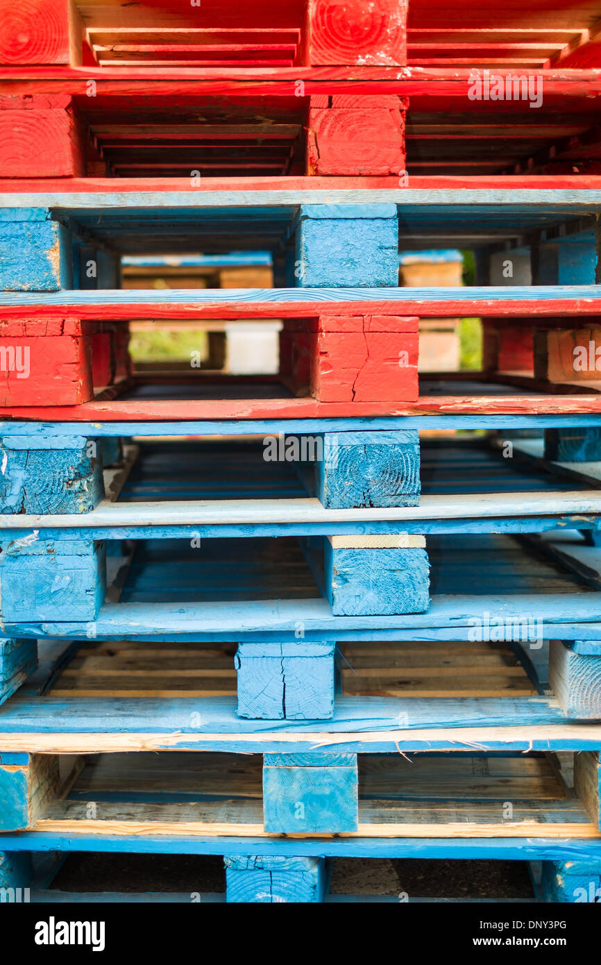 Colorful stack of shipping pallets Stock Photo