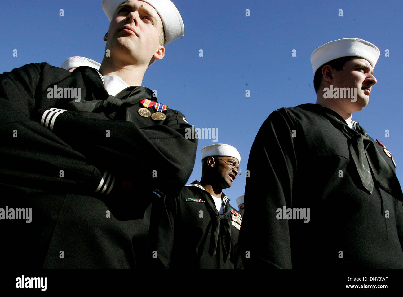 Jan 14, 2006; Ingleside, TX, USA; Crew members of the USS San Antonio Edmund Debit (from left), Tory Evans, and Joseph Lyles, await the beginning of the ship's commissioning ceremony at Naval Station Ingleside. Mandatory Credit: Photo by Mike Kane/San Antonio Express-News/ZUMA Press. (©) Copyright 2006 by San Antonio Express-News Stock Photo
