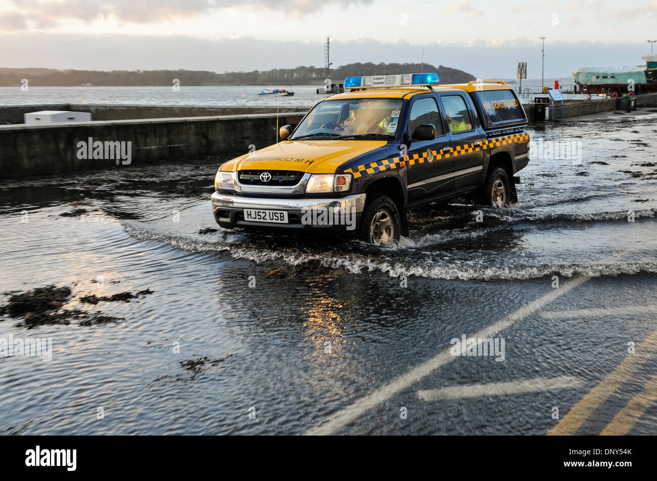 Portaferry, Northern Ireland. 6 Jan 2014 - A coastguard vehicle drives through seawater which has flooded the main road in Portaferry, Northern Ireland. The town was at risk of severe flooding caused by the high tides and the stormy weather. Credit:  Stephen Barnes/Alamy Live News Stock Photo