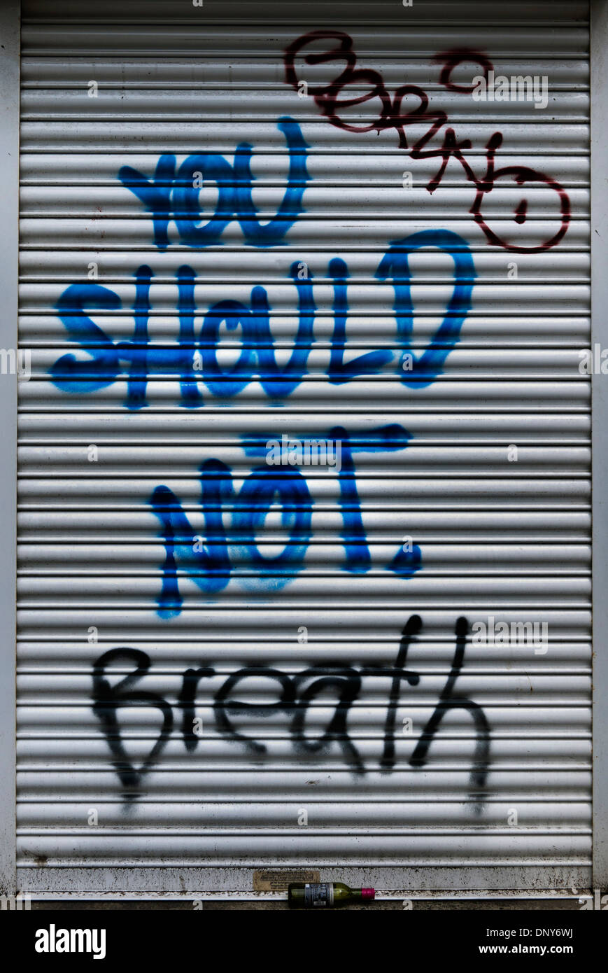 Graffiti 'You Should Not Breath' sprayed on roller blinds in London, UK Stock Photo