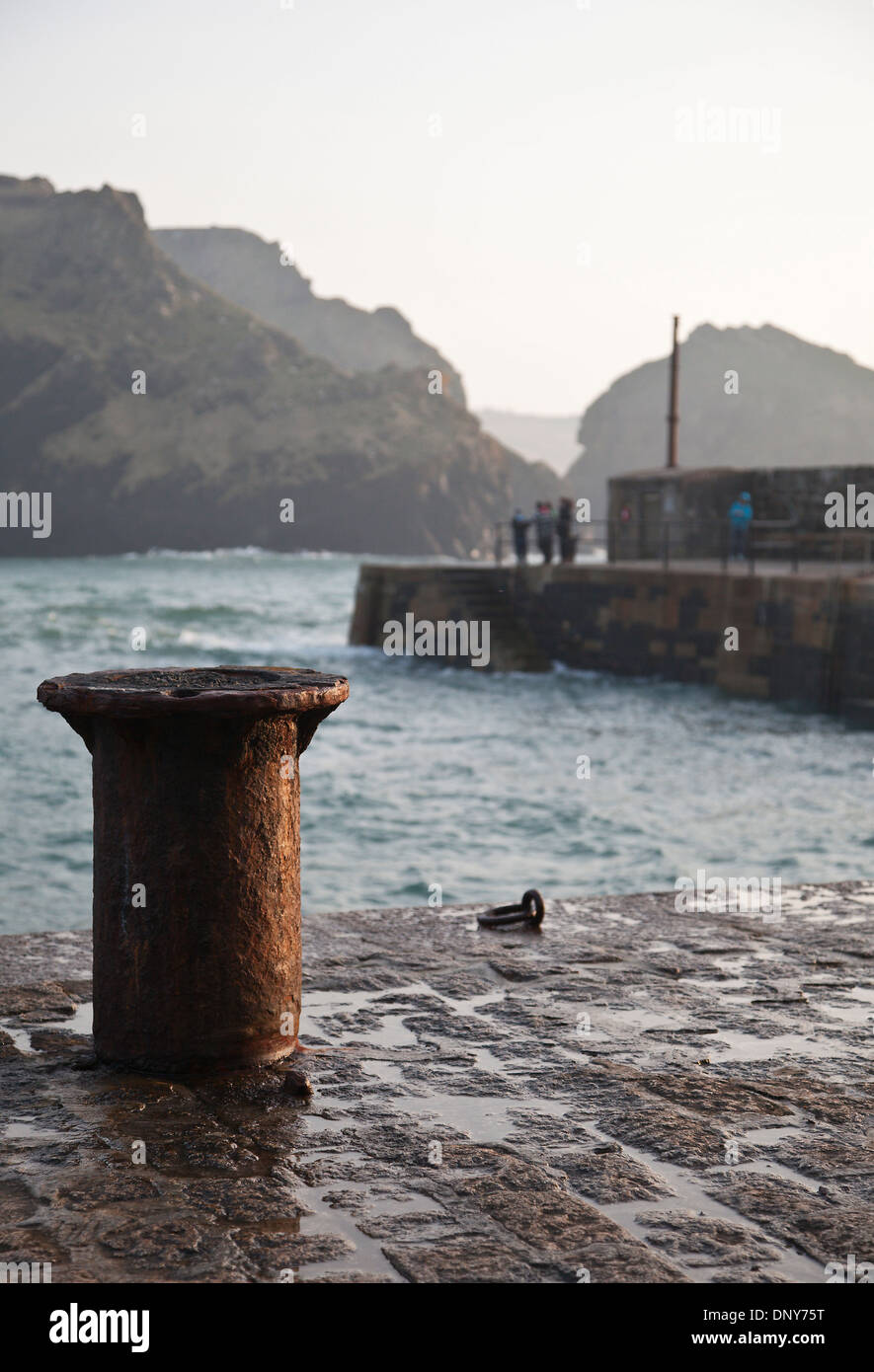 A mooring post and the pier at Mullion Cove harbour, Lizard Peninsula, Cornwall. Stock Photo