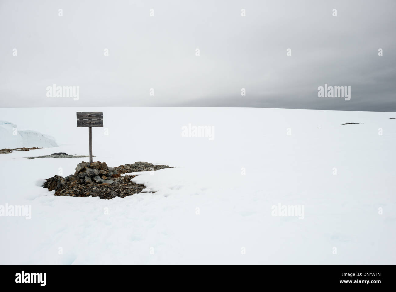 ANTARCTICA - An old wooden sign proclaims British Crown Land near historic Wordie House in Antarctica. Originally known as Base F and later renamed after James Wordie, chief scientist on Ernest Shackleton's major Antarctic expedition, Wordie House dates to the mid-1940s. It was one of a handful of bases built by the British as part of a secret World War II mission codenamed Operation Tabarin. The house is preserved intact and stands near Vernadsky Research Base in the Argentine Islands in Antarctica. Stock Photo