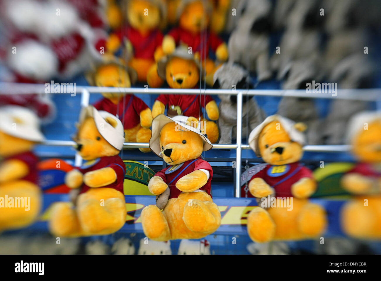 Jan 25, 2006; West Palm Beach, FL, USA; Detail of Winnie the Pooh stuffed animals that players of a water balloon game at the South Florida Fair can win. Cost to play is $5, but the prizes are larger. Mandatory Credit: Photo by Taylor Jones/Palm Beach Post /ZUMA Press. (©) Copyright 2006 by Palm Beach Post Stock Photo