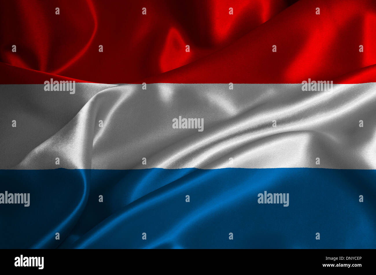 Luxembourg flag on satin texture. Stock Photo