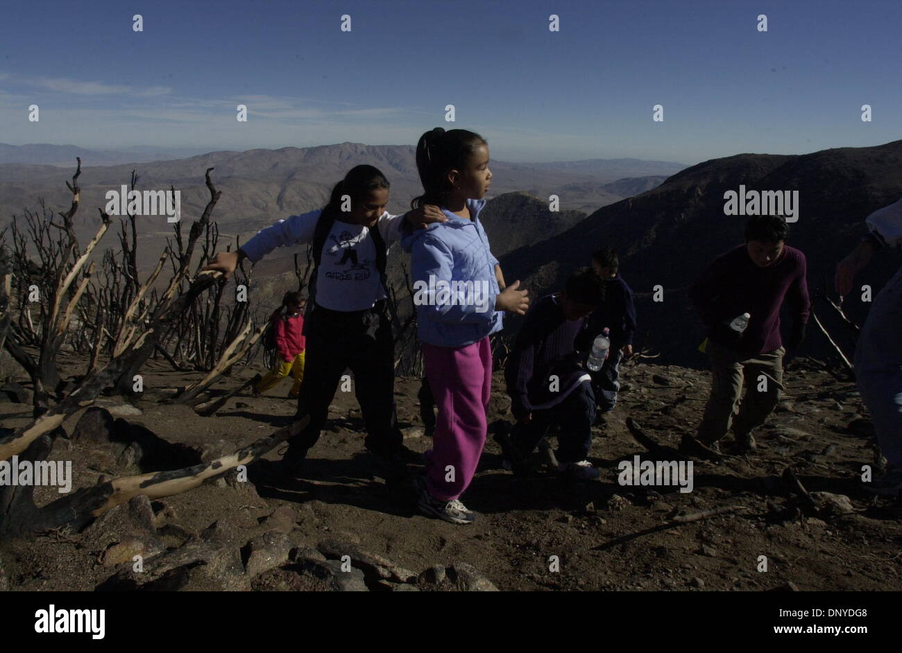 (PUBLISHED 01/27/2003, B-1) Concepcion Solano put a hand on Karina Sandoval as they hiked in the Laguna Mountains with other youngsters in a Sierra Club program. Stock Photo