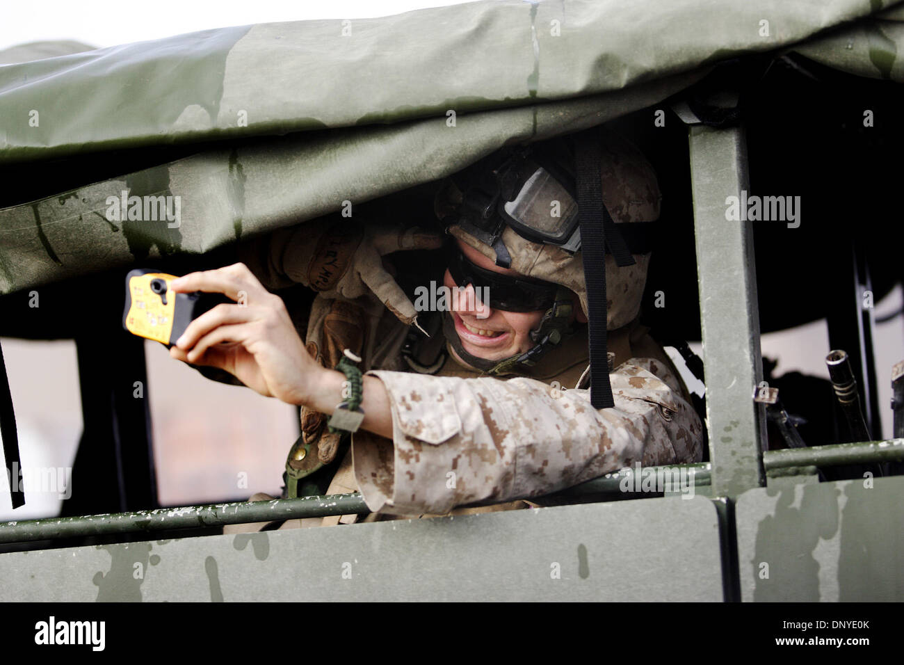 Jan 28, 2006; Al-Falujah, IRAQ; Lance Corporal Mike Dalrymple, a marine from Echo Company, Second battalion, 6th Marines, RCT-8, takes a picture of himself in the back of a 'Super Seven' 7-ton troop transport truck before going on patrol in Al-Falujah. Mandatory Credit: Photo by Toby Morris/ZUMA Press. (©) Copyright 2006 by Toby Morris Stock Photo