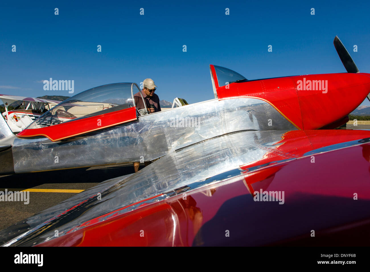 Visitor inspects a Van’s Aircraft RV8; Antique and modern airplanes at the annual Salida ArtWalk Fly-In event Stock Photo