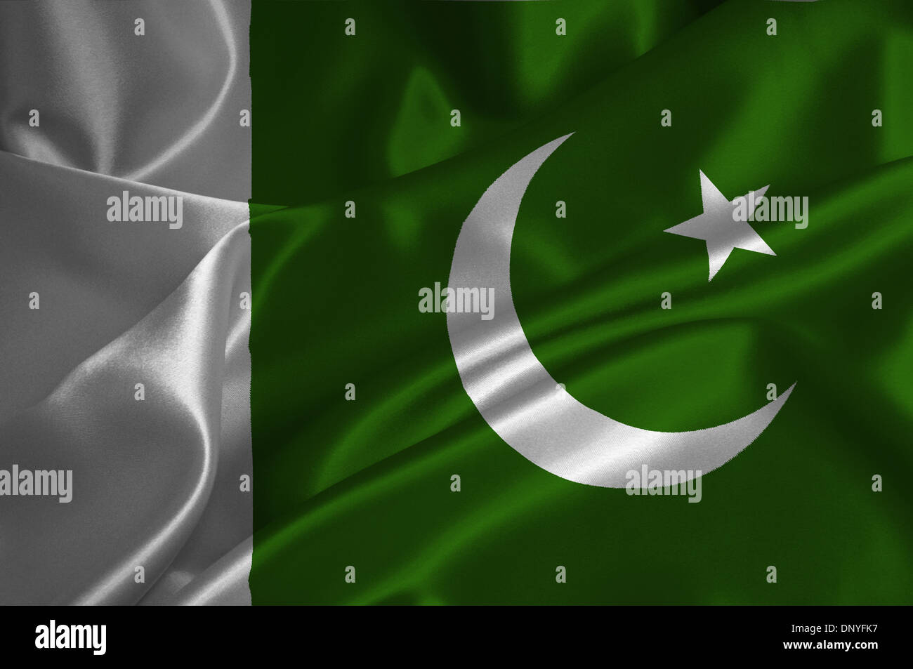 Pakistan flag on satin texture. Stock Photo