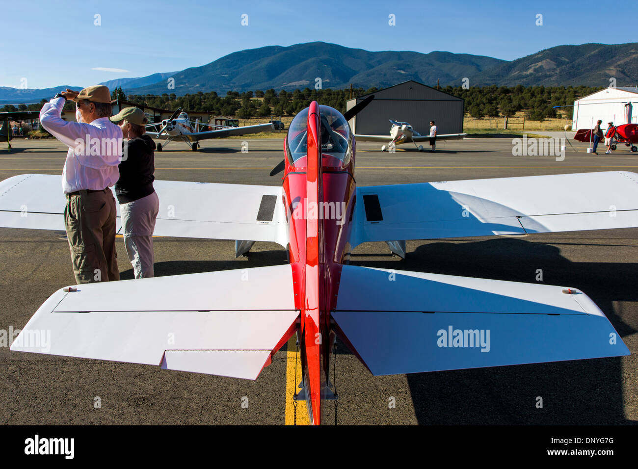 Couple enjoying antique and modern airplanes at the annual Salida ArtWalk Fly-In event; Van's Aircraft RV4. Stock Photo