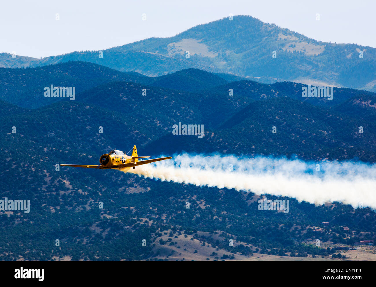 Model SNJ-7B, Navy Trainer approaching landing strip; Antique and modern airplanes at the annual Salida ArtWalk Fly-In event Stock Photo