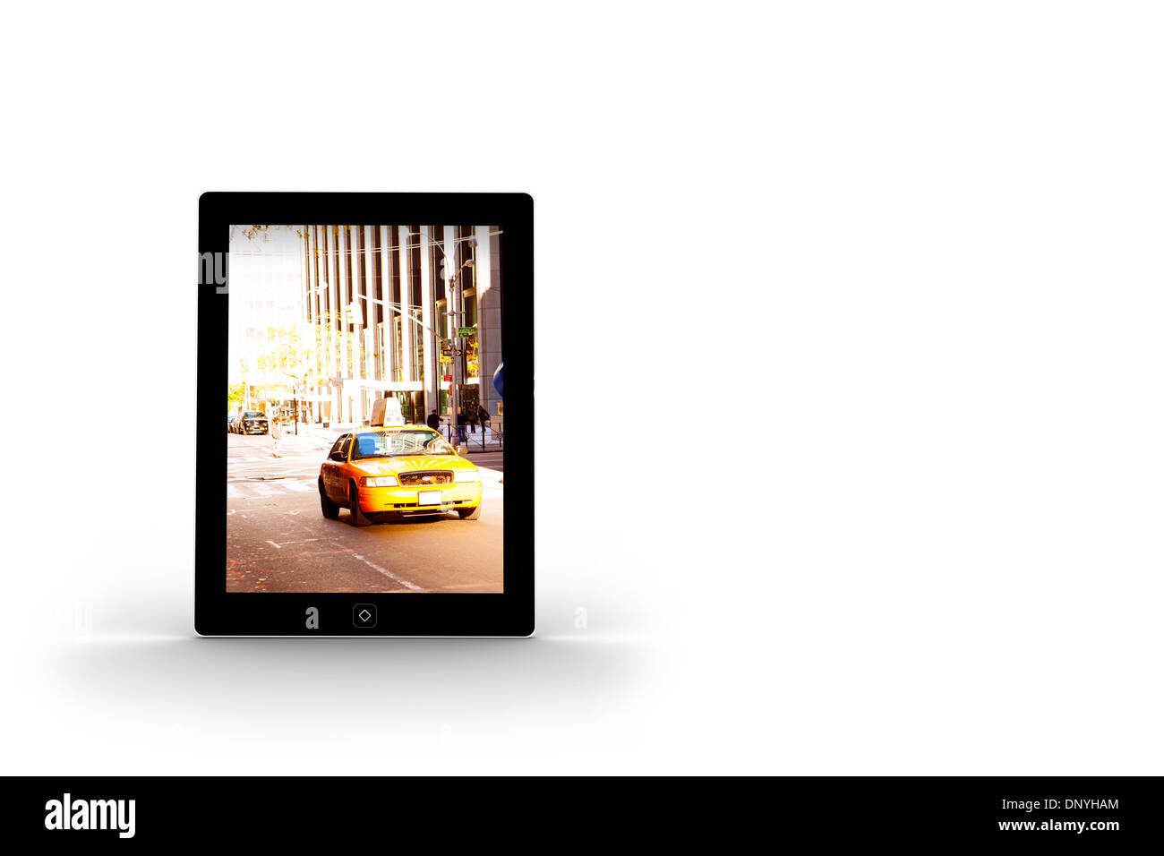 Yellow taxi on tablet screen Stock Photo