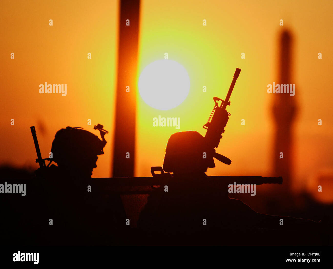 Jan 30, 2006 - Al-Falujah, Iraq - A silhouette of marines with weapons at sunset from Echo Company, Second battalion, 6th Marines, RCT-8, sits in a humvee during a patrol of the city of Falujah. (Credit Image: © Toby Morris/ZUMA Press) Stock Photo