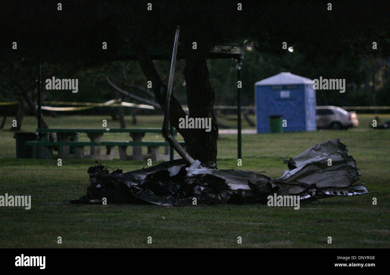Feb 08, 2006; La Mesa, CA, USA; Parts from a mid-air airplane/helicopter crash lie in Harry Griffin Park in El Cajon, CA on Feb. 8, 2006. The plane crashed in La Mesa, CA and left three dead. Mandatory Credit: Photo by Charlie Neuman/San Diego Union T/ZUMA Press. (©) Copyright 2006 by San Diego Union T Stock Photo