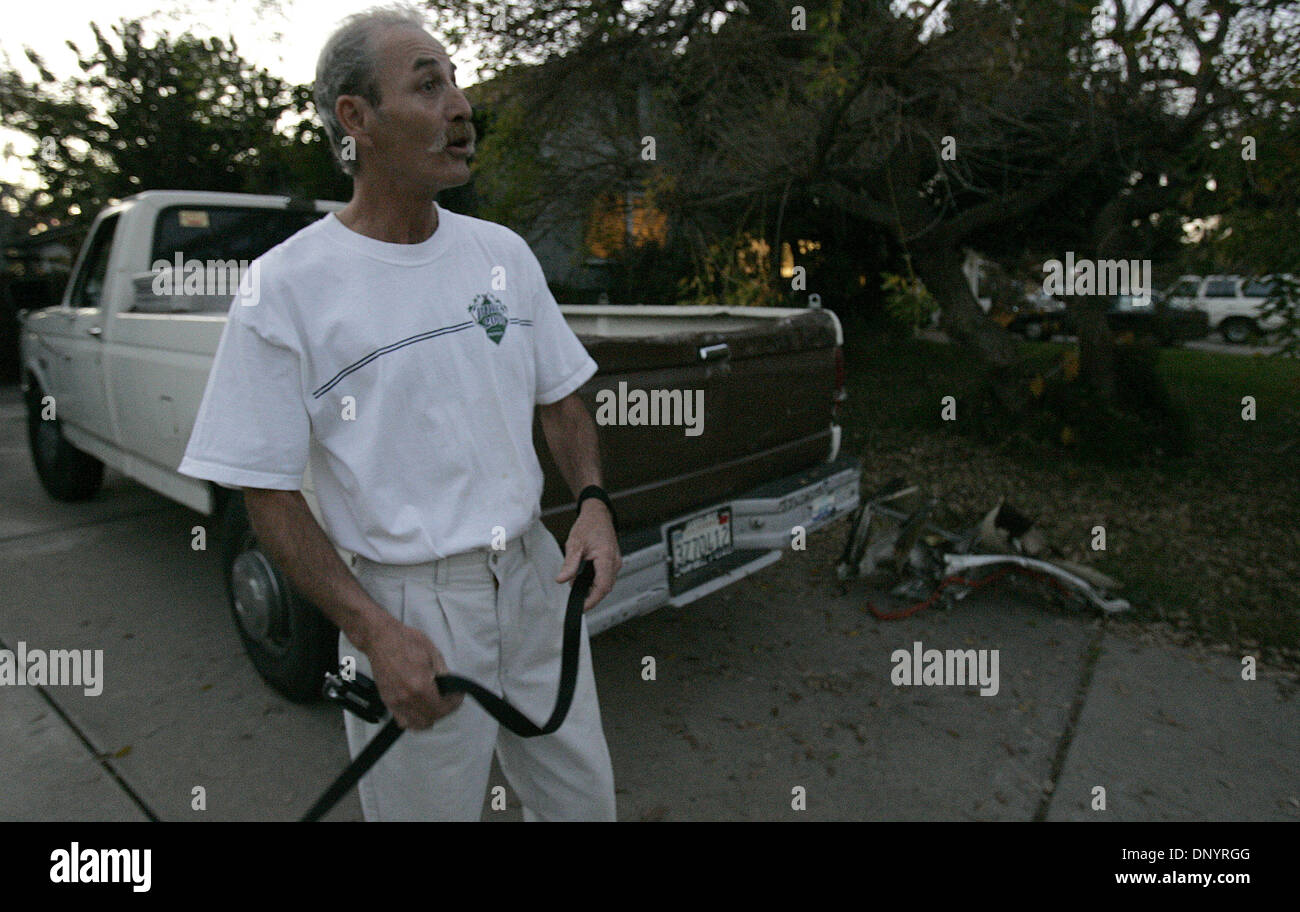 Feb 08, 2006; La Mesa, CA, USA; PAT MCCANCE stands in front of his house in El Cajon where parts from an earlier airplane/helicopter mid-air crash hit his truck and are still in view in his driveway. The plane crashed in La Mesa, CA and left three dead. Mandatory Credit: Photo by Charlie Neuman/San Diego Union T/ZUMA Press. (©) Copyright 2006 by San Diego Union T Stock Photo