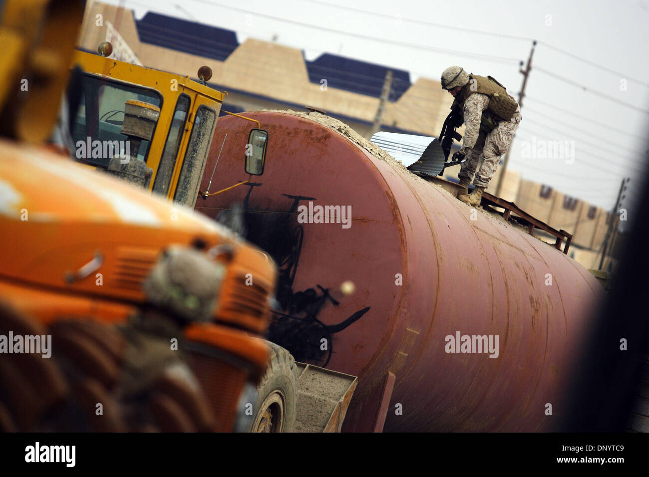 Feb 08, 2006; Al-Falujah, IRAQ; A marine from Weapons company 2nd marine division, 2nd battalion, 6th marine regiment, RCT-8, 4th platoon (callsign Black Label)  searches a tanker truck in the Iraqi city of Al-Falujah. Mandatory Credit: Photo by Toby Morris/ZUMA Press. (©) Copyright 2006 by Toby Morris Stock Photo