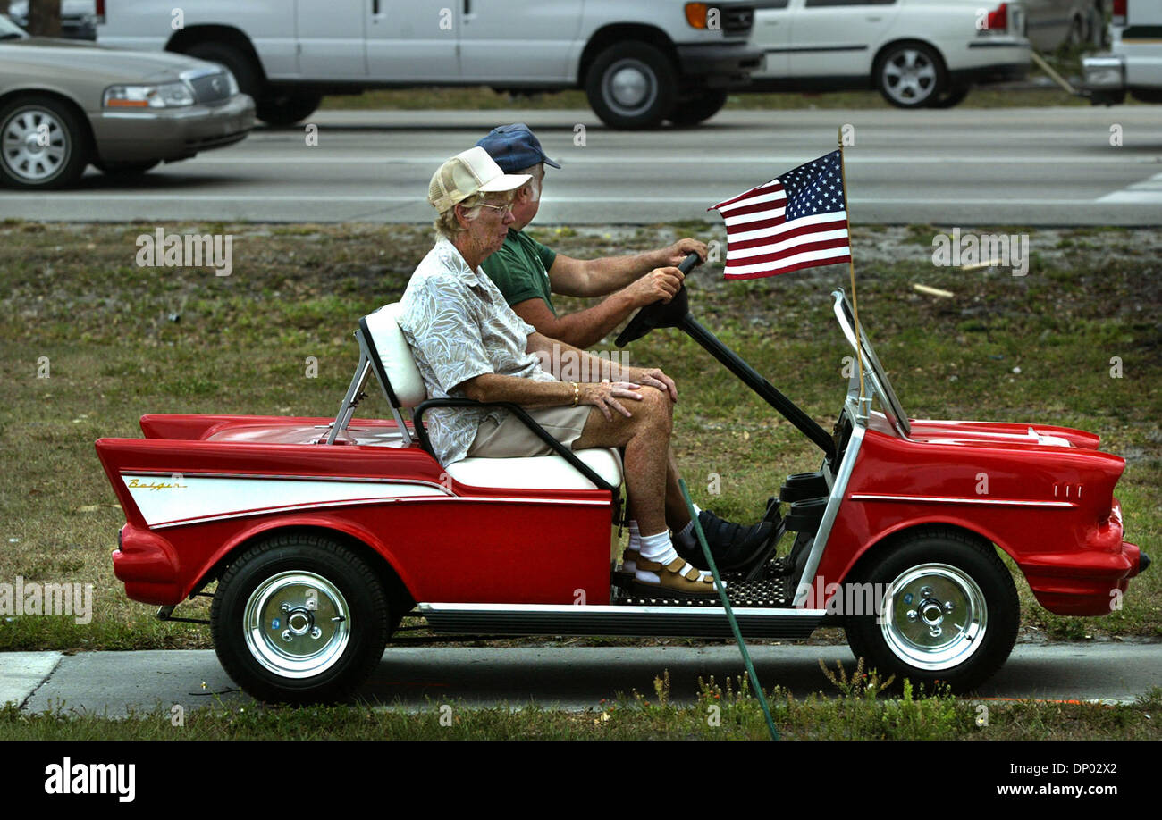 Feb 26, 2006; Ft. Pierce, FL, USA; When Betty and Ray Henkiel of Ft. Pierce retired to Florida from Binghampton, New York in 2001, they made a most unusual purchase:  a  golf cart customized after an American classic:  the 1957 Chevrolet BelAir.  On tuesday, they were heading north along a sidewalk next to US 1 to lunch:  they were going to a favorite submarine sandwich shop.  Sayi Stock Photo