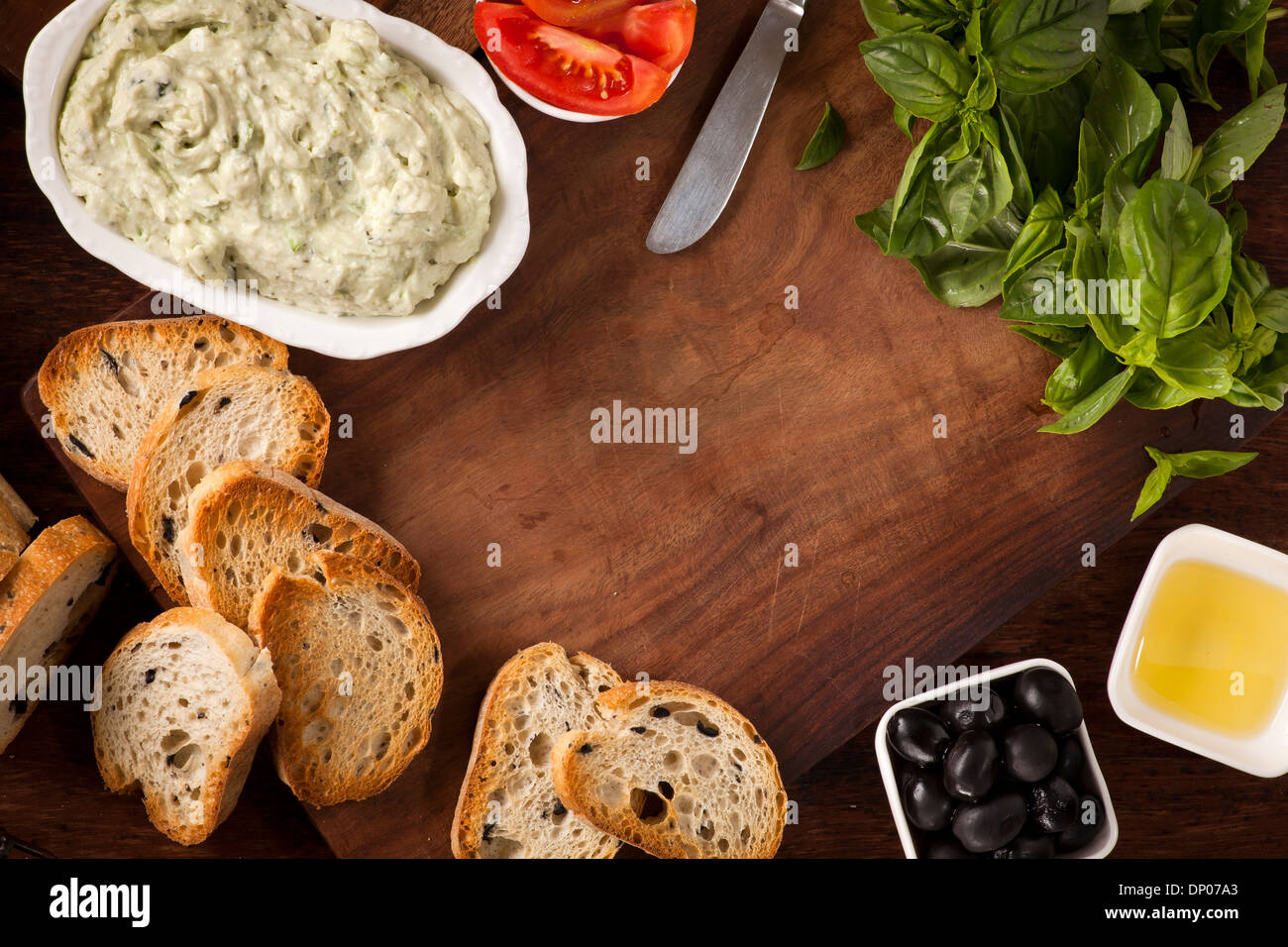 Crostini with mozzarella and fresh basil and olives Stock Photo