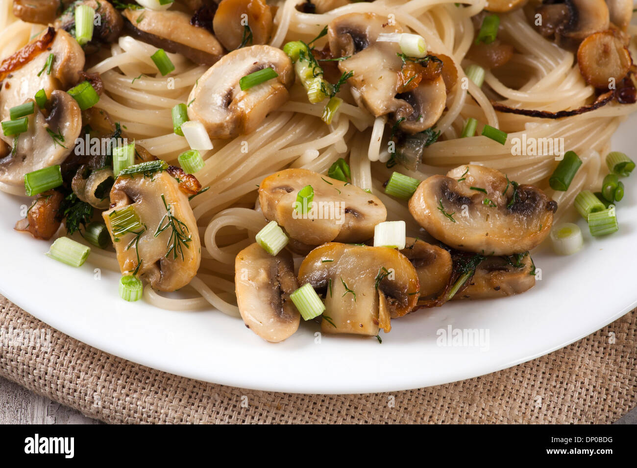 Spaghetti with mushrooms and herbs Stock Photo