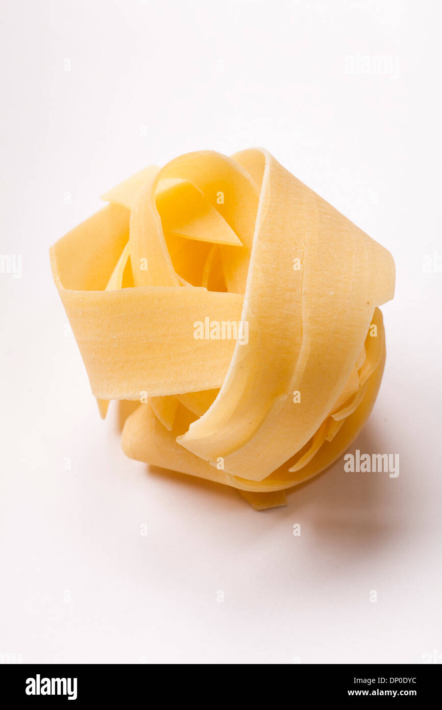 Spilled raw pappardelle pasta Stock Photo