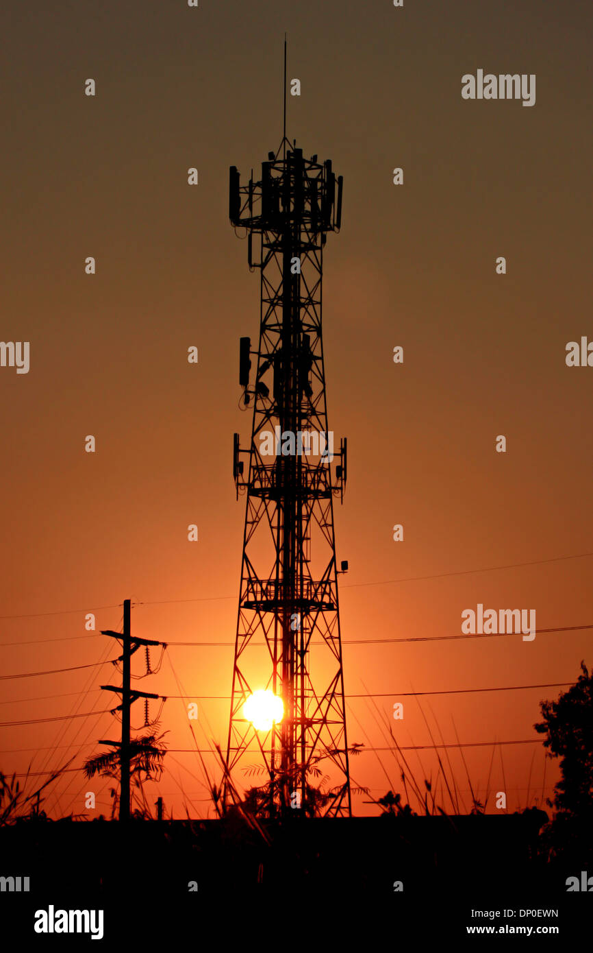 Sunset of Phone antenna with Silhouette. Stock Photo
