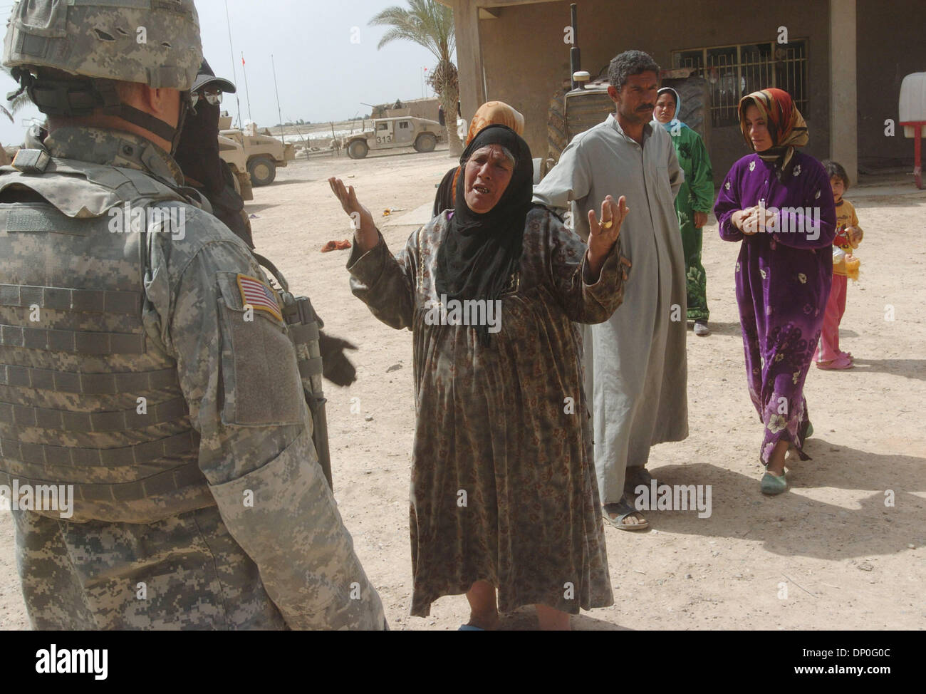 Mar 18, 2006; Saluhiddin, IRAQ; The mother of two detained suspected insurgents, one of whom might be the cavalry squadron's most wanted insurgent, asks why her sons are being detained during Operation Swarmer March 18, 2006. Nearly 1,500 US and Iraqi soldiers, 50 attack and transport helicopters and 200 ground vehicles were out during the operation northeast of Ad Dawr and Samarra Stock Photo