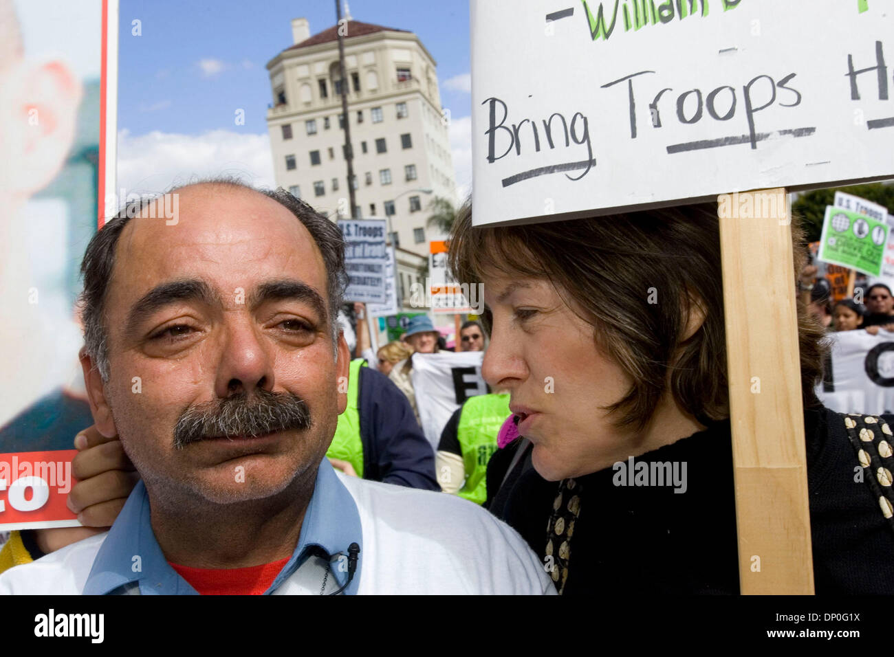 Mar 18, 2006 - Los Angeles, CA, USA - Actress MIMI KENNEDY, the co-star of Dharma and Greg, consoles FERNANDO SUAREZ DEL SOLAR at the Stop the War Protest commemorating the third anniversary of the US invasion of Iraq.  Fernando's son, Jesus Alberto Suarez del Solar was killed in Iraq in 2003 when he stepped on a cluster bomb. Ever since then, Fernando has been speaking out against Stock Photo