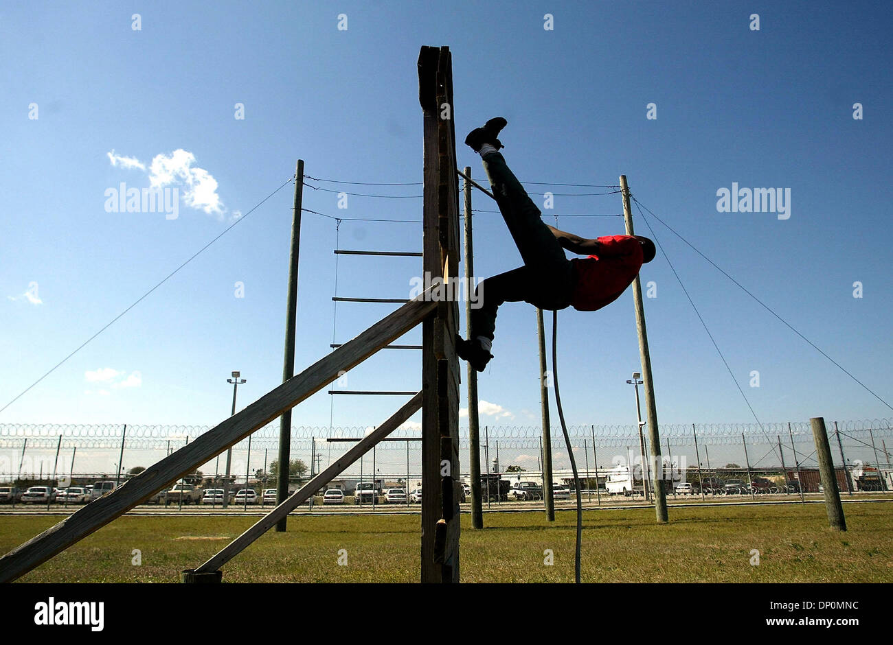 Mar 28, 2006; Stuart, FL, USA; A cadet struggles over a wall in the obstacle course at the Martin County Sheriff's Office boot camp in Stuart. Mandatory Credit: Photo by Paul J. Milette/Palm Beach Post /ZUMA Press. (©) Copyright 2006 by Palm Beach Post Stock Photo