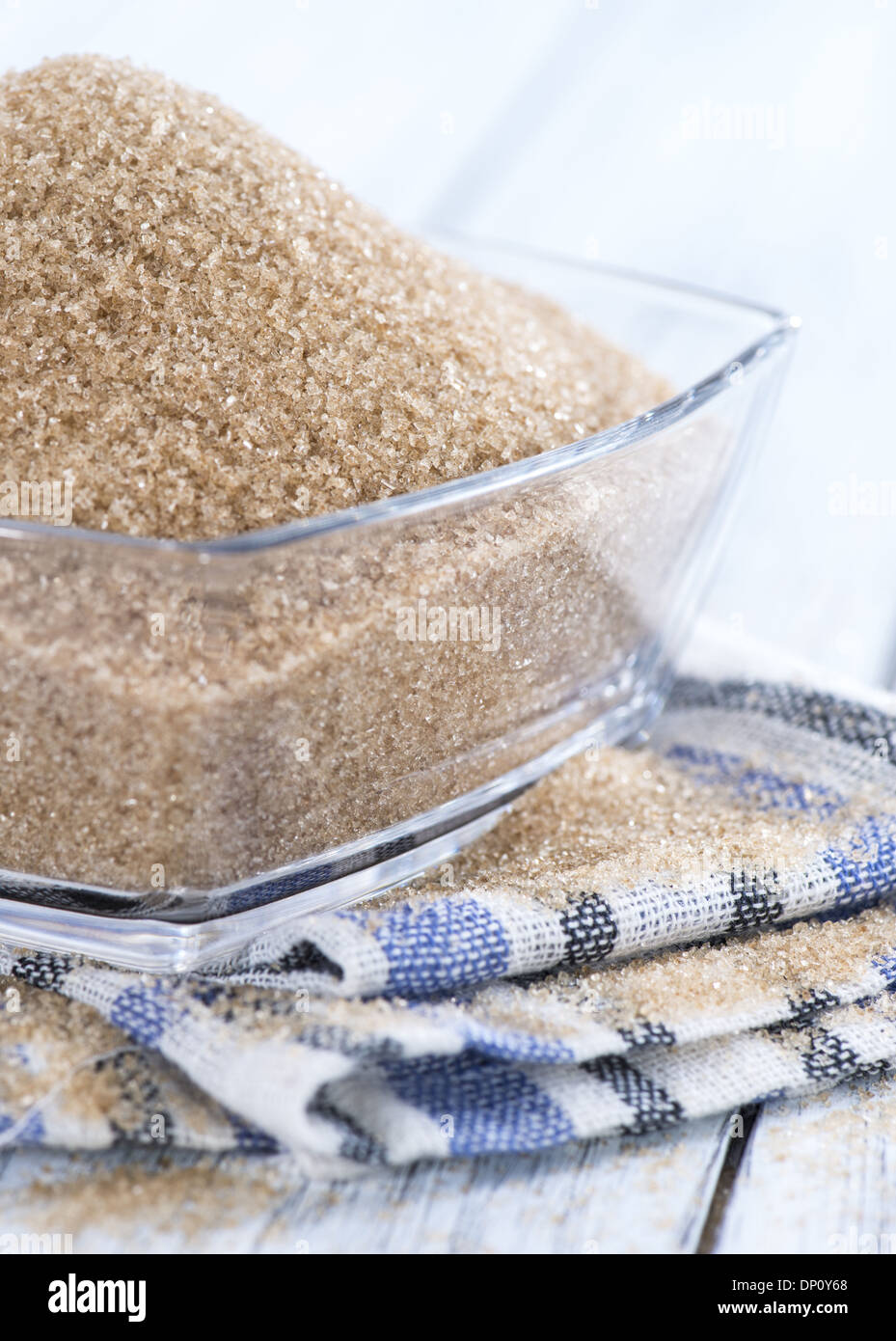 Bowl filled with Brown Sugar on wooden background Stock Photo