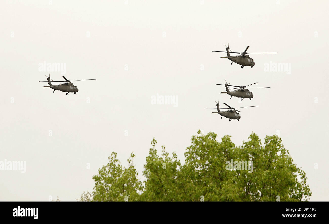 Apr 12, 2006; Arlington, VA, USA; Four helicopters in the 'Missing Man Formation,' fly over during the funeral for Sgt. William E. Dillender in Arlington National Cemetery on April 12, 2006. The Department of Defense POW/Missing Personnel Office announced on February 14, 2006, that the remains of Maj. Jack L. Barker, Waycross, Fa.; Capt. John F. Dugan, Roselle, N.J.; Sgt. William E Stock Photo