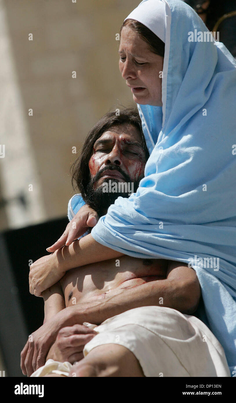 Apr 14, 2006; San Antonio, TX, USA; Mary , played by Linda Daniel , weeps while holding her crucified son Jesus, played by Derly Cirlos, during San Fernando Cathedral's annual Via Crucis in downtown San Antonio. Mandatory Credit: Photo by Mike Kane/ZUMA Press. (©) Copyright 2006 by San Antonio Express-News Stock Photo
