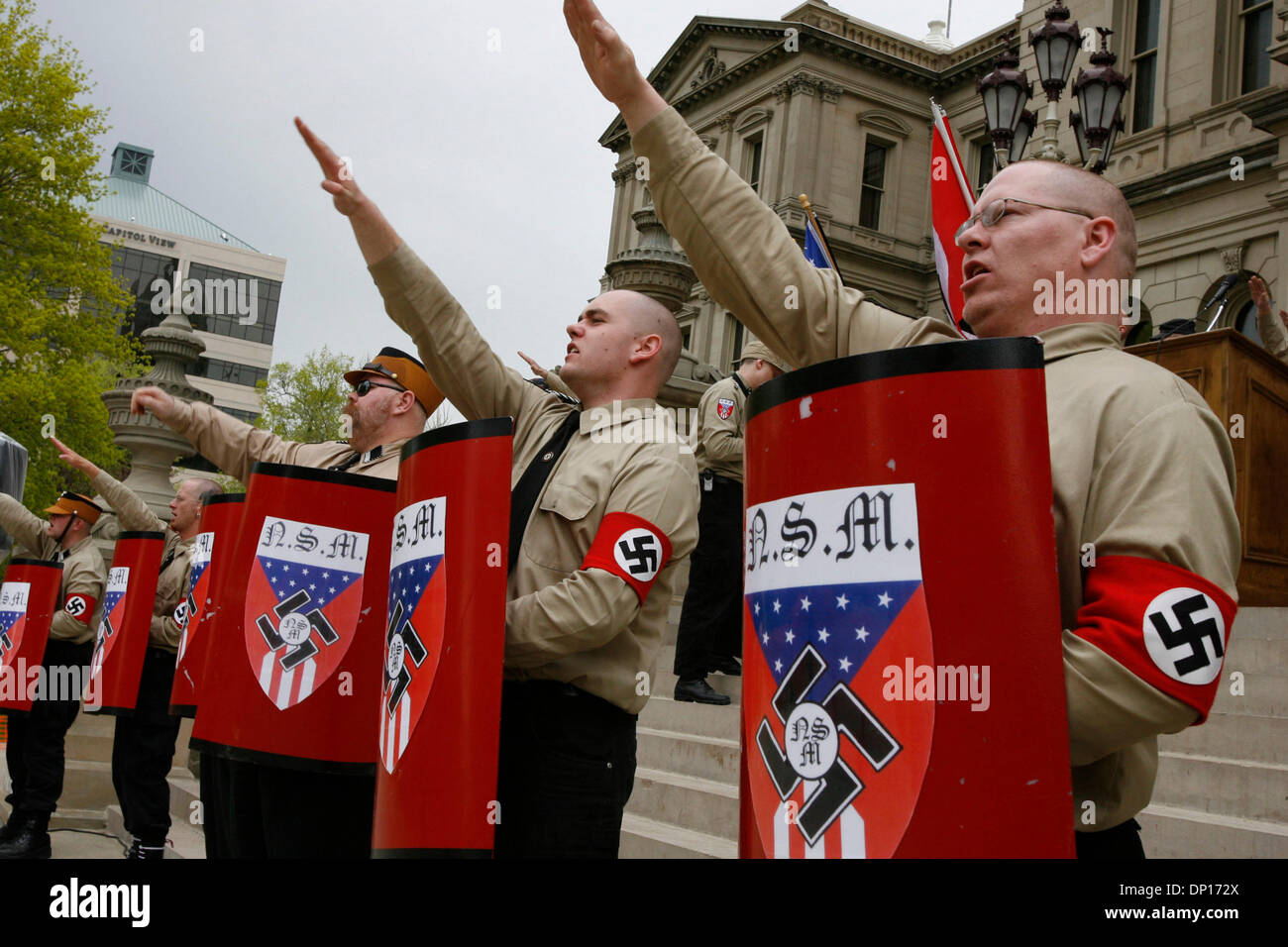 Apr 22, 2006; Lansing, MI, USA; The National Socialist Movement, a Neo-Nazi group, rallies in Lansing. Michigan, protesting against illegal immigrants which have allegedly contributed to dramatic job losses in the state.  Security was very high with the Nazi group being bussed in from a remote location under heavy police escort.  Some anti-racism protesters threatened to kill the N Stock Photo