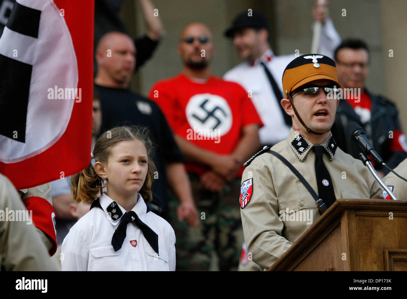 Apr 22, 2006; Lansing, MI, USA; The National Socialist Movement, a Neo-Nazi group, rallies in Lansing. Michigan, protesting against illegal immigrants which have allegedly contributed to dramatic job losses in the state.  Security was very high with the Nazi group being bussed in from a remote location under heavy police escort.  Some anti-racism protesters threatened to kill the N Stock Photo