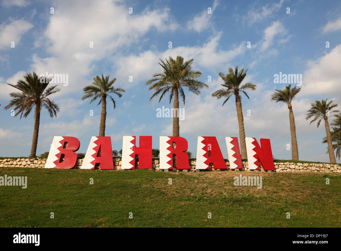 Bahrain sign under Palm Trees in Manama Stock Photo