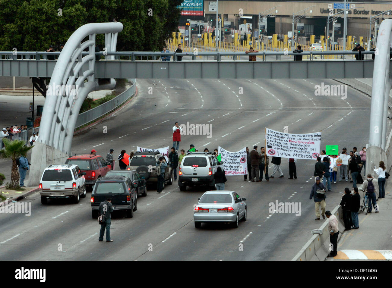 May 01, 2006;  Lakeside, CA, USA; Early Monday morning, dozens of protesters formed  a human chain across northbound lanes at the San Ysidro border crossing Monday to stop fellow Mexicans from going to jobs or shopping in San Diego. Police had to push the protesters to to the side so cars could move forward to the U.S.  Mandatory Credit: Photo by Peggy Peattie/SDU-T/ZUMA Press. (©) Stock Photo