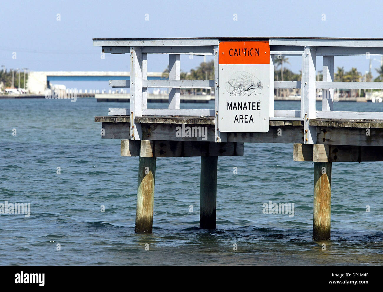 May 05, 2006; Boyton Beach, FL, USA;  A manatee warning sign is affixed to the pier where 'Delray,' a 925-pound adolescent manatee, was released into the Intracoastal Waterway in Boynton Beach Friday, May 5, 2006. 'Delray' was rescued in in Delray Beach on January 2, 2006 after he was struck on the back by a boat propellor, leaving terrible gashes on his back and fracturing his sku Stock Photo