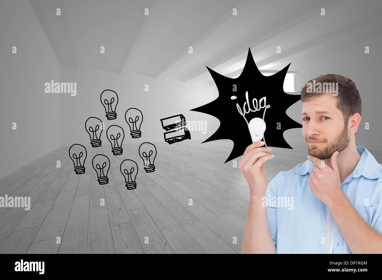 Composite image of handsome model holding a bulb Stock Photo