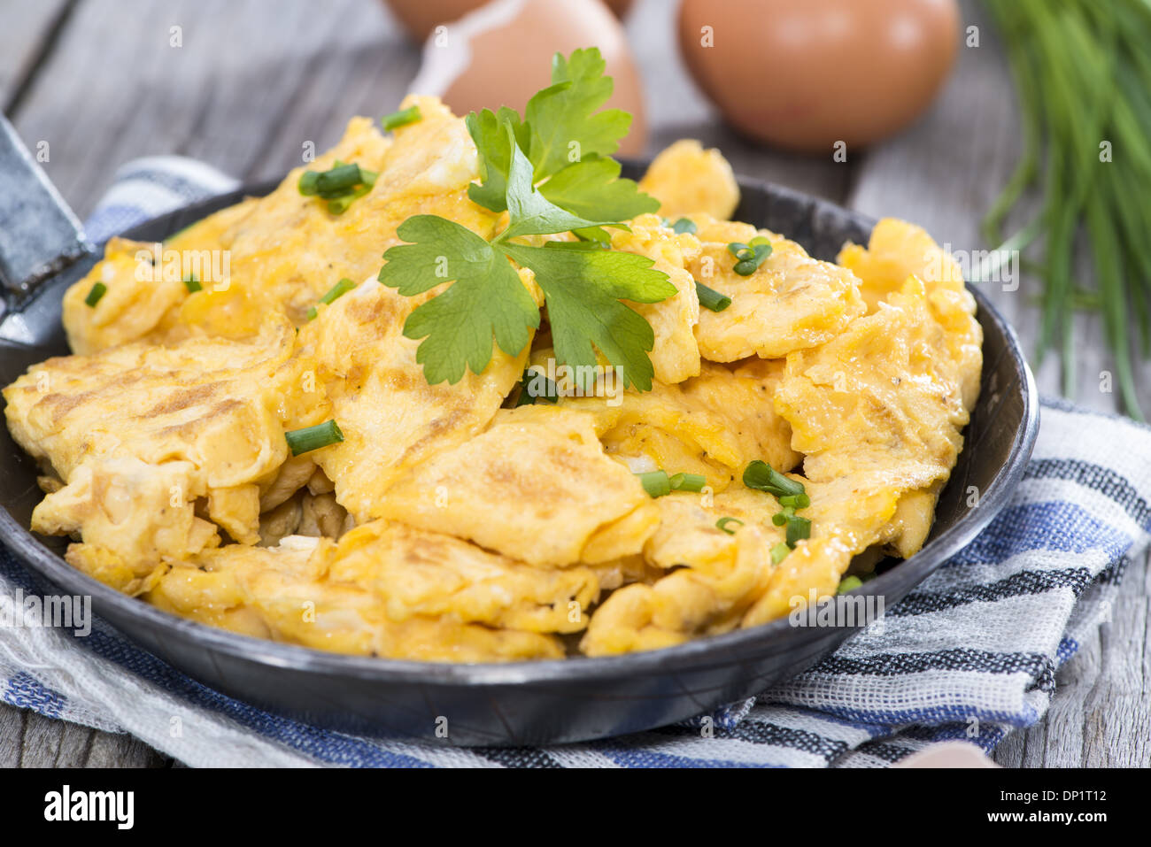 Scrambled Eggs with fresh eggs and herbs Stock Photo - Alamy